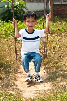 An handsome Asian kid of Thailand in Playground