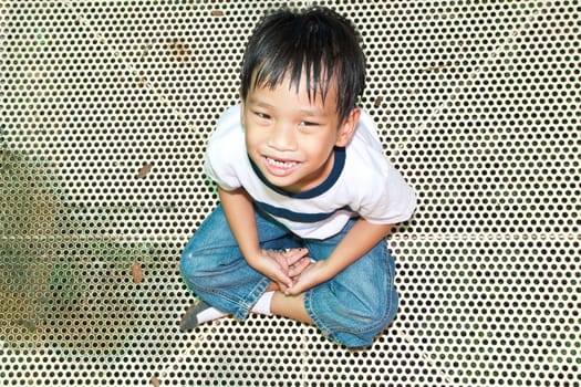 An handsome Asian kid of Thailand in Playground