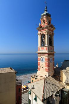 bell tower and village of Sori, small town in Liguria, Italy 