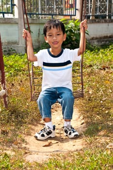 An handsome Asian kid of Thailand in Playground