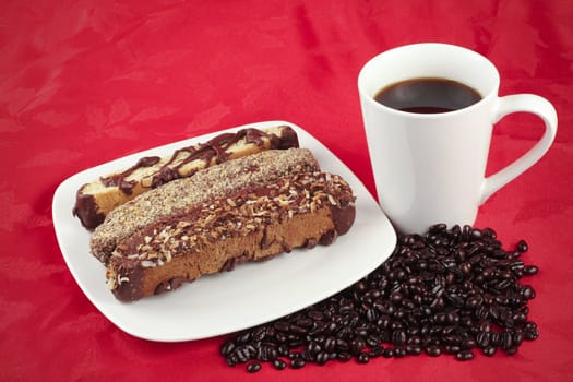 Coffee and Biscotti on a red textured background