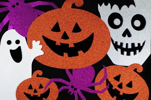 Textured Halloween background with jack-o-lanterns, skulls, ghosts, and spiders