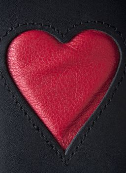 Leather heart symbol red on black stiched