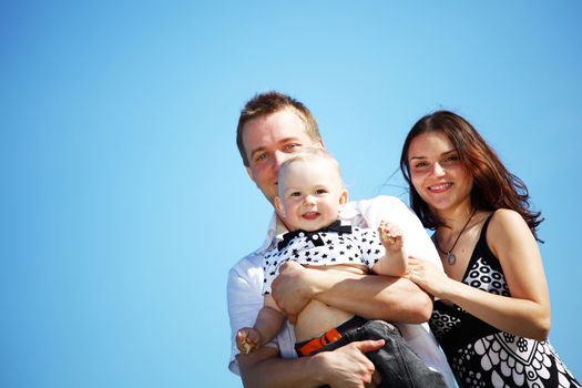 happy family on blue sky background