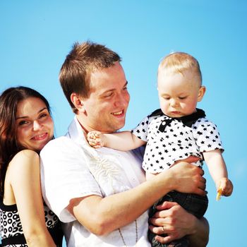 happy family on blue sky background