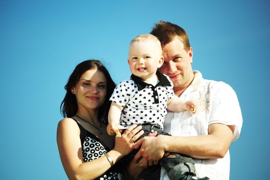 happy family on blue sky background