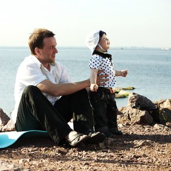 picnic of happy family near sea