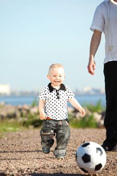 father and son play in soccer