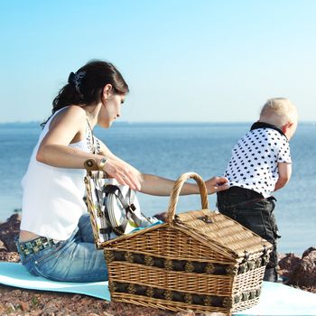 picnic of happy family near sea