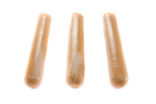A picture of three single sausages with nothing on