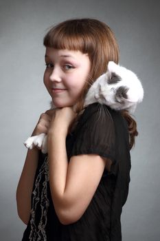 the girl and white cat play. close up. double 5