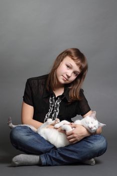 the girl and white cat play. close up. double 4