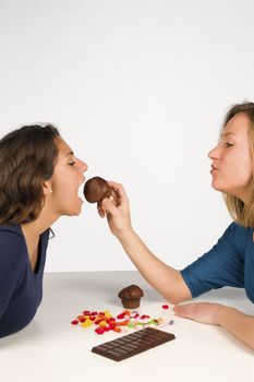 Giving in to a treat, two friends having fun