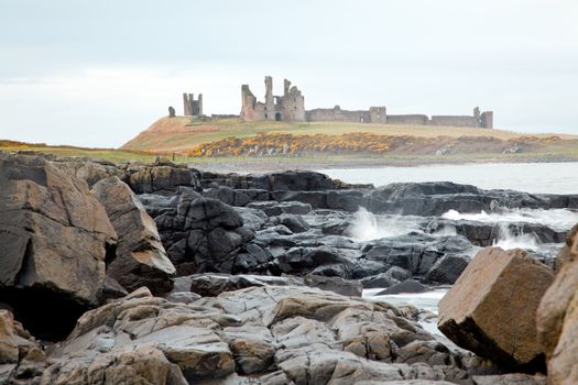 Dunstanburgh castle on the north east coast of the UK near Craster in Northumberland