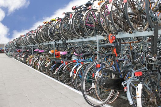 Plenty bicycles at parking lot in 