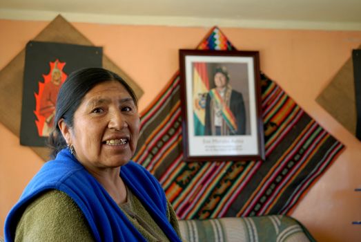 Oruro, Bolivia, June 14, 2006. Esther Morales sister of the President of Bolivia Evo Morales.Esther proudly displays the official photo of her brother Evo as head of government. After the death of their mother Trial 'as a child ages.