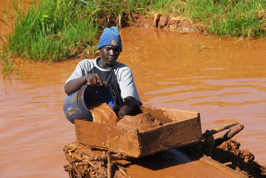 Shinyanga, Tanzania March 18, 2010:Young gold miner search. Tanzania is the third gold producer in Africa after Ghana and South Africa.