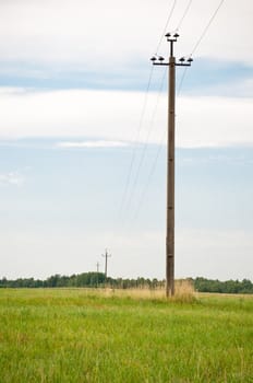 Shot of electric pole, countryside landscape, summer