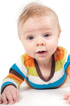 Shot of little baby lying on white background