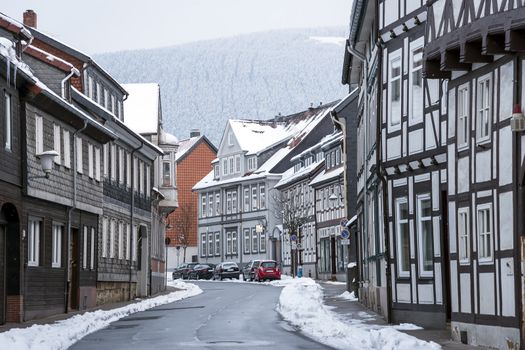 Street with half-timbered houses with snowfall in Goslar, Germany