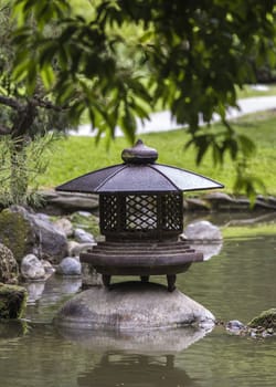 Japanese garden with water pond 