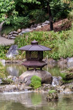 Japanese garden with water pond 