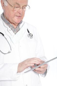 Closeup cropped portrait of a senior doctor working on a tablet standing scrolling on the touchscreen with his finger