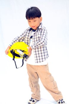 Asian Baby boy in yellow helmet holding hammer - isolated on white background