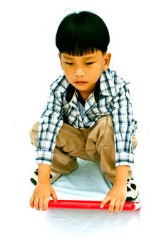 Asian little boy with blank marker board - isolated on white background