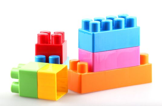 Plastic building blocks isolated on white background.