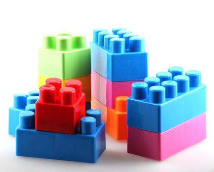 Plastic building blocks isolated on white background.