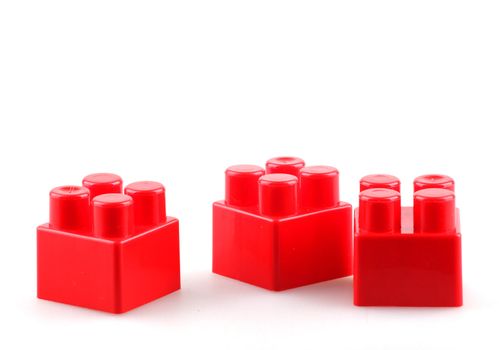 Plastic building blocks isolated on white background.