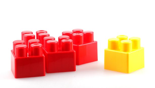 Plastic building blocks isolated on white background.