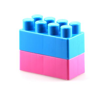 Plastic building blocks isolated on white background.