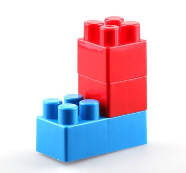 Plastic building blocks isolated on white background.