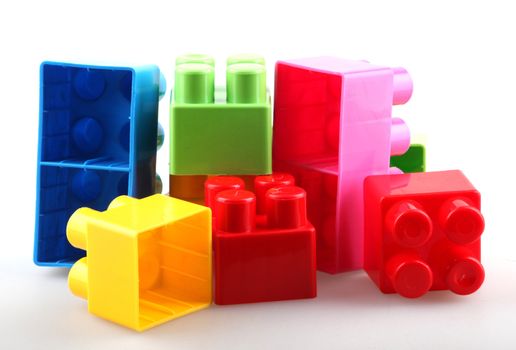 Plastic building blocks isolated on white background.