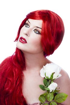 Beautiful red haired with fresh flowers in her hand. Spring concept.