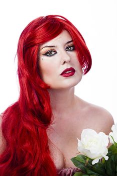Beautiful red haired with Spring Flowers. Fresh skin concept