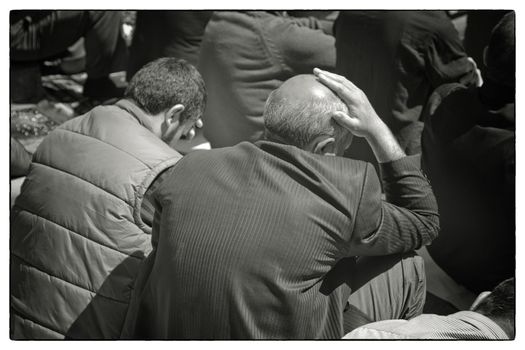 OUTDOOR FRIDAY PRAYER, ISTANBUL, TURKEY, APRIL 13, 2012: Crowd of muslim men praying in the street ouside Eyup Salim Mosque, Istanbul, Turkey.