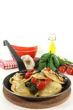 fresh Rocket and Ricotta Cappelletti with pine nuts, tomatoes and basil