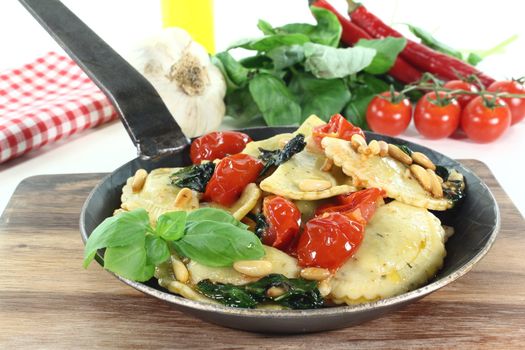 Rocket and Ricotta Cappelletti with pine nuts, tomatoes and fresh basil