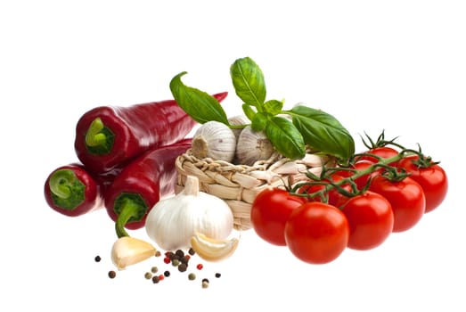 Peppers, tomatoes, garlic, shot on a white background.