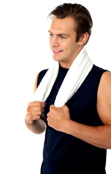 Handsome man posing with towel around neck isolated over white