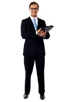 Full length view of relaxed businessman holding a folder isolated over white