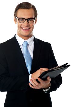 Caucasian smiling young businessman holding a folder isolated on white