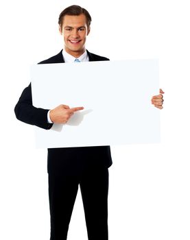 Male representative pointing towards placard, isolated on white