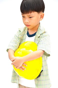 Asian Baby boy in yellow helmet holding hammer - isolated on white background