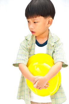 Asian Baby boy in yellow helmet holding hammer - isolated on white background