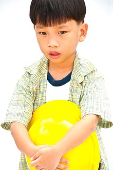 Asian Baby boy in yellow helmet holding hammer - isolated on white background