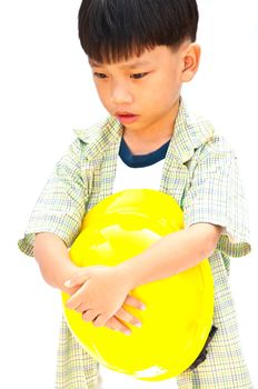 Asian Baby boy in yellow helmet holding hammer - isolated on white background